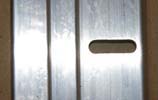 Close up of adjustment slots on Kennel Door Rails